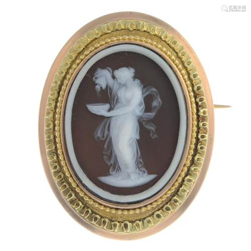 A late 19th century gold onyx cameo brooch.Len…