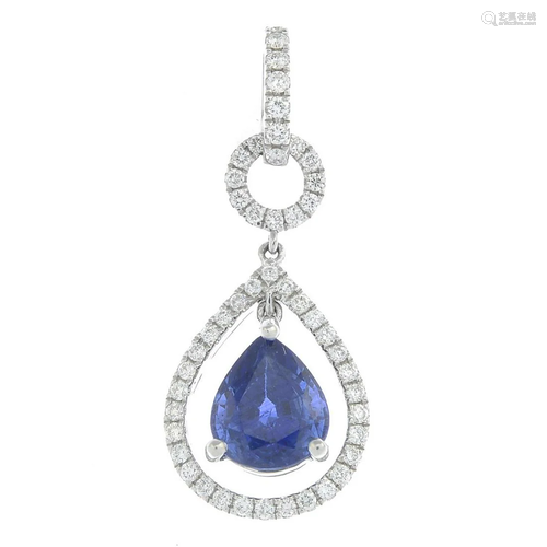 An 18ct gold sapphire and diamond pendant.Sapphire