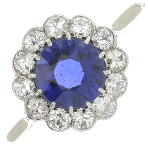 A synthetic sapphire and diamond cluster ring.Esti…