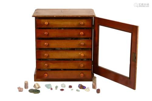 A collector's chest of loose gemstones and minerals