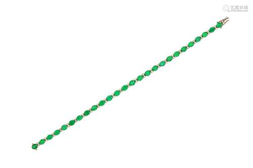 An emerald and diamond line bracelet