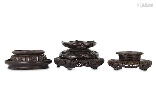 FOUR CHINESE CIRCULAR WOOD STANDS.