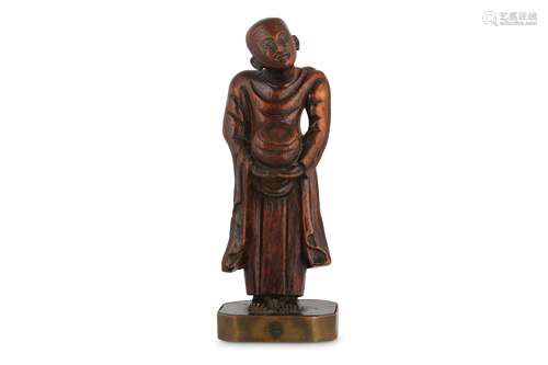 A CHINESE BAMBOO CARVING OF AN ACOLYTE.