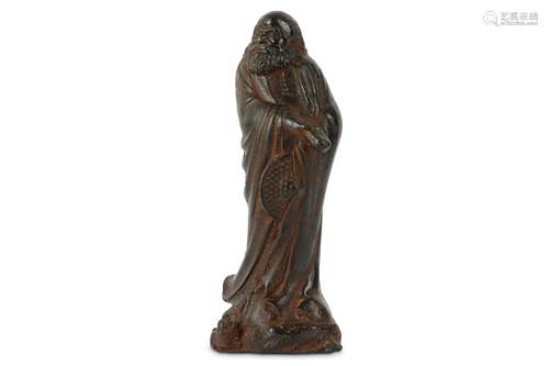 AN IRON FIGURE OF A STANDING BODHIDHARMA.