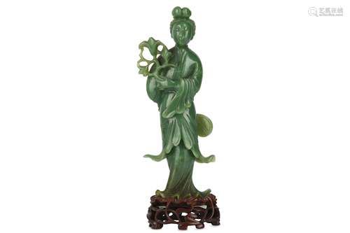 A CHINESE GREEN JADE FIGURE OF AN IMMORTAL LADY.