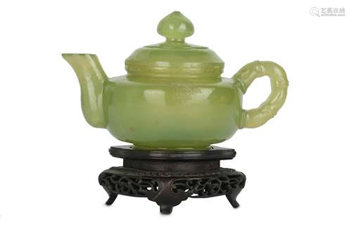 A CHINESE SERPENTINE TEAPOT AND COVER.