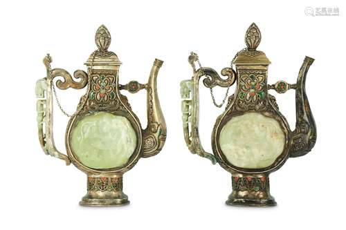 A PAIR OF CHINESE JADE-INLAID TIBETAN-STYLE SILVER EWERS AND COVERS.