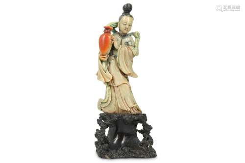 A CHINESE STAINED SOAPSTONE 'IMMORTAL MAIDEN' CARVING.