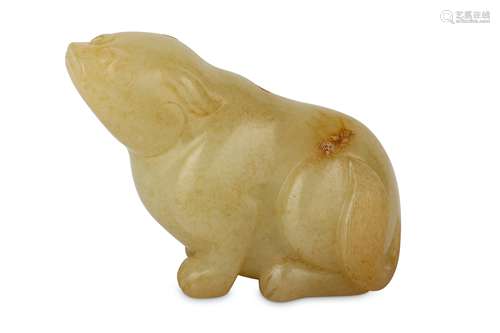 A CHINESE PALE CELADON CARVING OF A DOG.