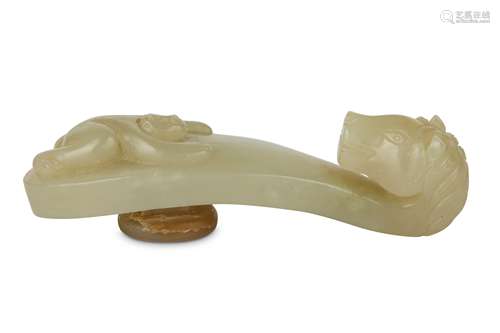 A PALE CELADON JADE 'HORSE AND MONKEY' BELT HOOK.