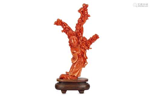 A CHINESE CORAL 'MAGU' CARVING.