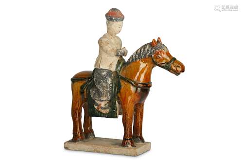 A CHINESE SANCAI-GLAZED FIGURE OF A HORSE AND RIDER.