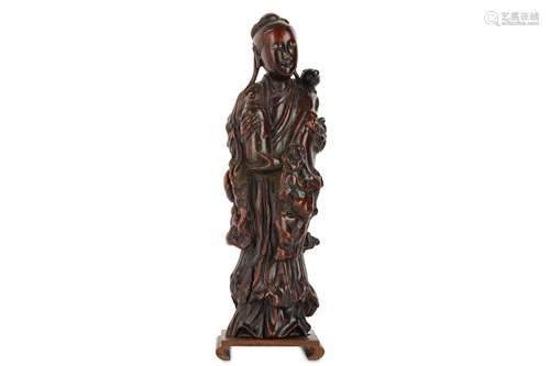 A CHINESE ROOTWOOD CARVING OF A LADY.