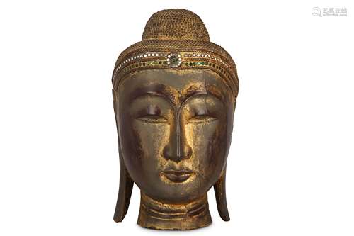 A GILT WOOD BUDDHA'S HEAD.