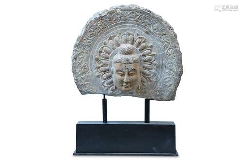 A CHINESE STONE HEAD OF A BUDDHA.