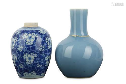 A CHINESE BLUE AND WHITE PRUNUS VASE AND A CLARE-DE-LUNE BOTTLE VASE.