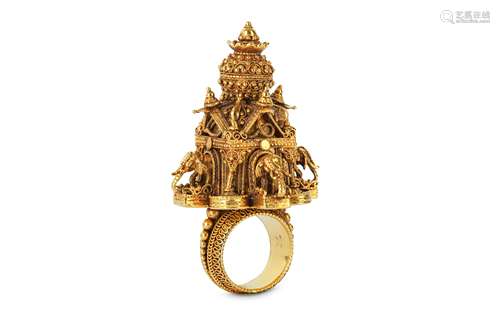 A GOLD TEMPLE STUPA RING.