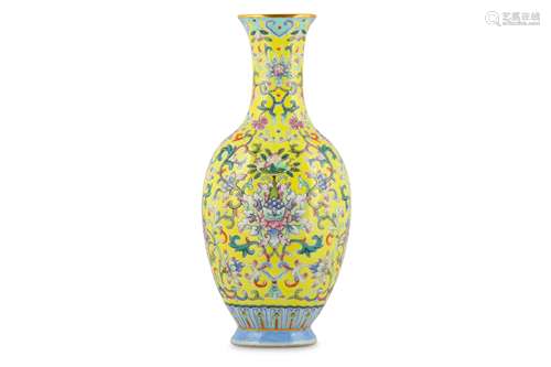 A CHINESE FAMILLE ROSE YELLOW-GROUND ‘LOTUS’ VASE.