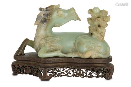 A CHINESE PALE CELADON JADE CARVING OF A QILIN.