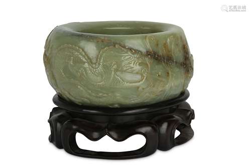 A CHINESE CELADON JADE ‘DRAGON’ BRUSH WASHER.