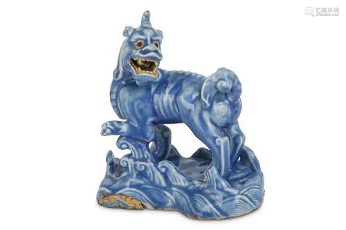 A CHINESE BLUE-GLAZED BISCUIT MODEL OF A QILIN.