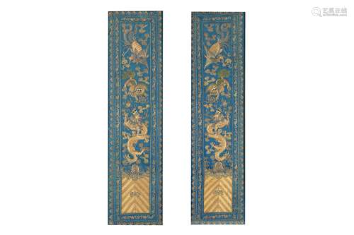 A PAIR OF CHINESE SILK BLUE-GROUND EMBROIDERED PANELS.