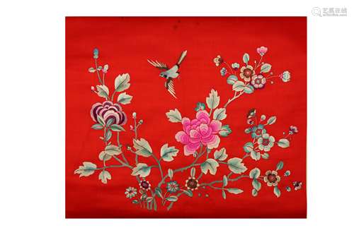 A CHINESE RED GROUND 'FLOWERS' EMBROIDERED TEXTILE HANGING SCROLL.