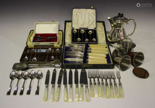 A group of plated items, including a water jug, a set of six teaspoons and matching sugar tongs,
