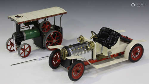 A Mamod SA1 steam roadster, finished in white with red spoked wheels, and a Mamod steam tractor.