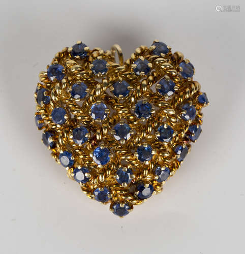 A Tiffany & Co gold and sapphire pendant brooch in the form of an openwork heart, claw set with