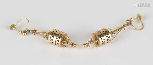 A pair of gold pendant earrings, each of cylindrical pierced form with scrollwork and bead surmounts