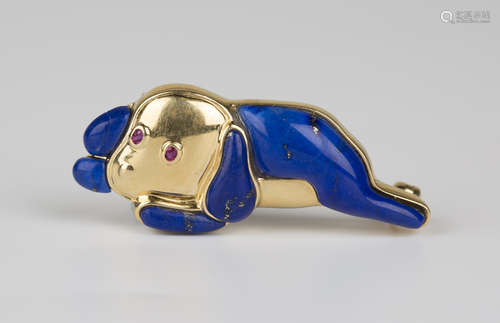 A Gübelin 18ct gold, lapis lazuli and ruby brooch, circa 1970s, in the form of a recumbent dog,