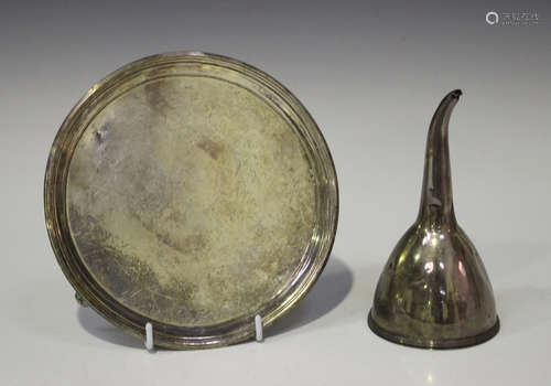 A George III silver circular card salver, raised on scroll feet, London 1802 by William Bennett,