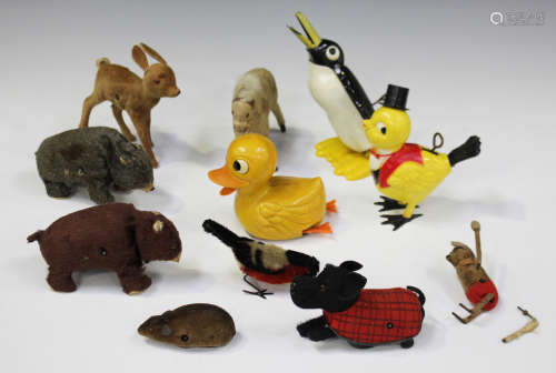 Eleven clockwork animals, including a Schuco mouse, a dog, an Alps bear and a penguin (playwear