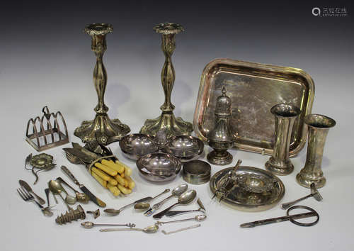 A small group of silver flatware, including a George V pusher, a similar sterling example and a