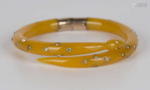 A gold mounted colourless paste set twin-sectional bangle of snake form, inside diameter 5.7cm.