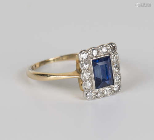 A gold, sapphire and diamond rectangular cluster ring, mounted with the rectangular step cut