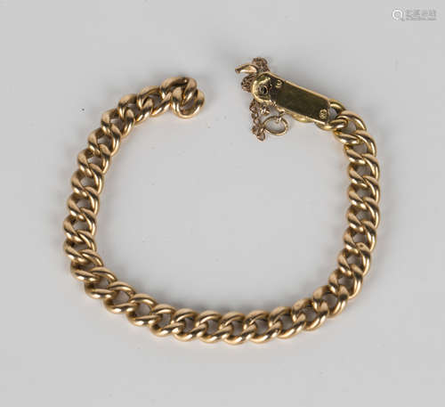 A gold hollow curblink bracelet on a snap clasp, detailed '15', length 18cm (broken).Buyer’s Premium