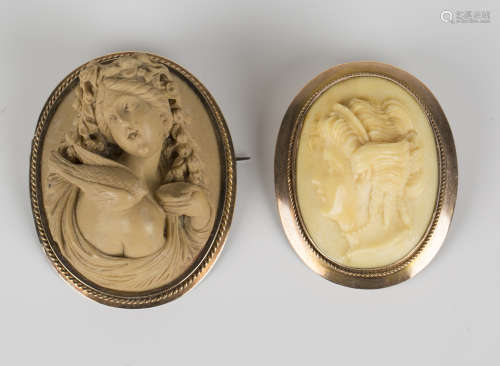 An oval larva cameo brooch, second half 19th century, carved as a portrait of a lady within a