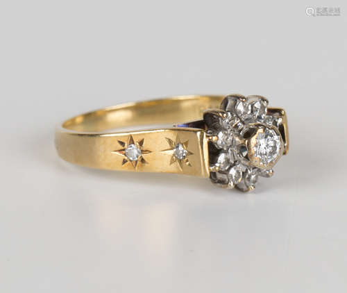 A gold and diamond cluster ring, mounted with the principal circular cut diamond within a surround