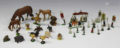 A collection of painted flat lead religious figures and a small collection of painted wood