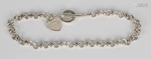 A group of Tiffany silver jewellery, comprising an oval link neckchain with a heart shaped