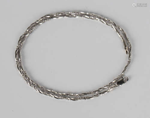 A 9ct white gold necklace in a twisted three stand faceted bead and faceted brazil link ropetwist