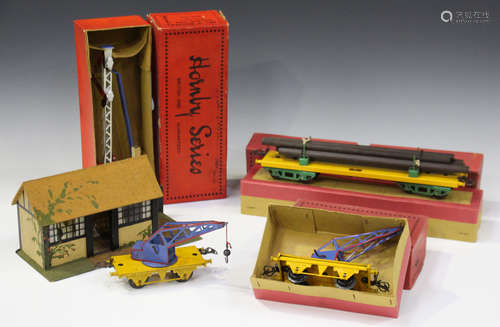 A small collection of Hornby Series gauge O railway items, including two crane trucks, an American