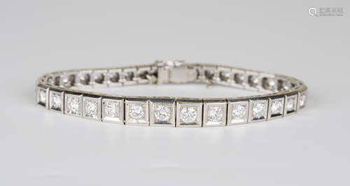 A French white gold and diamond bracelet, claw set with circular cut diamonds graduating in size