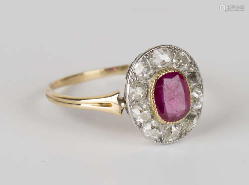 A gold, Burmese ruby and diamond oval cluster ring, collet set with a cushion cut Burmese ruby