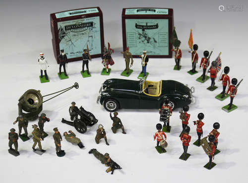 A collection of Britains and other lead soldiers, bandsmen and sailors, together with a Bburago