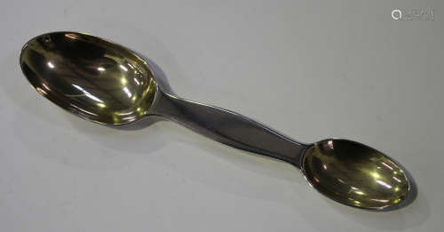 An Edwardian silver double-ended medicine spoon with gilt bowls, London 1902 by Francis Higgins,
