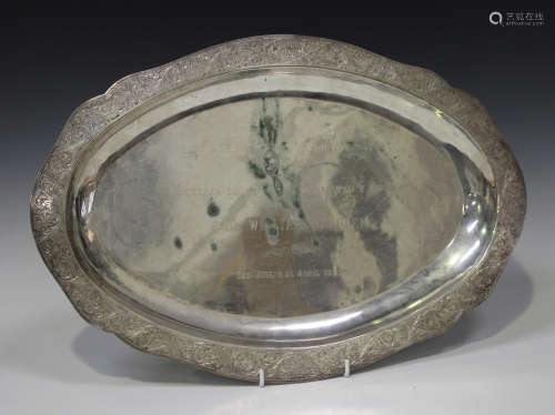 A Continental .900 silver oval tray, the rim engraved with foliate scrollwork, length 47cm.Buyer’s