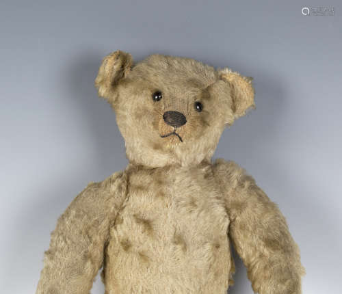 A Steiff mohair teddy bear, circa 1910, with boot button eyes, stitched snout and claws and